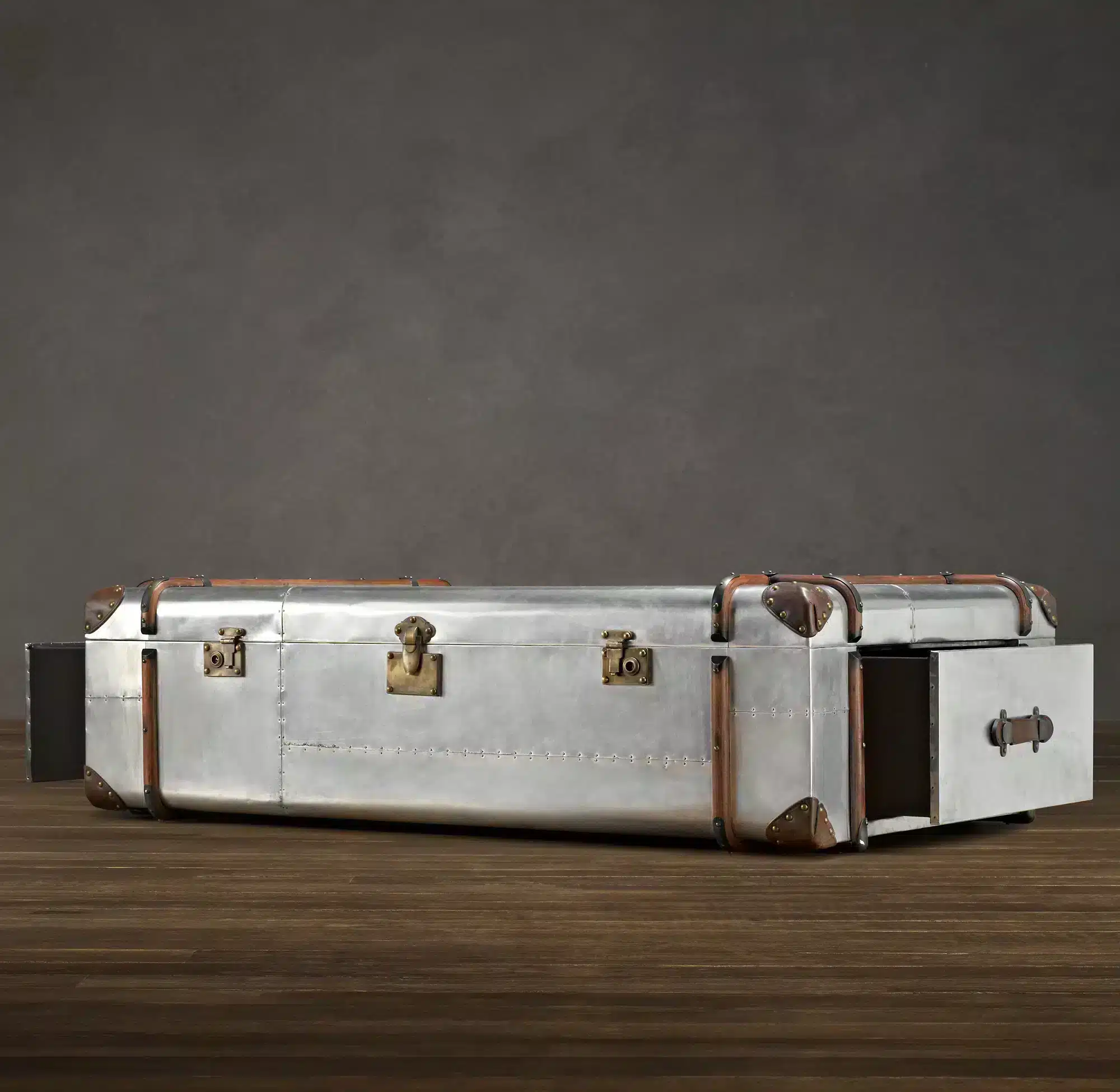 The aviator trunk coffee table is inspired by a worn, custom-made steamer trunk.