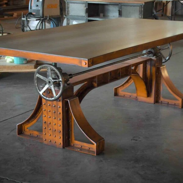 A Bronx Crank table with a orange base and metal table top.