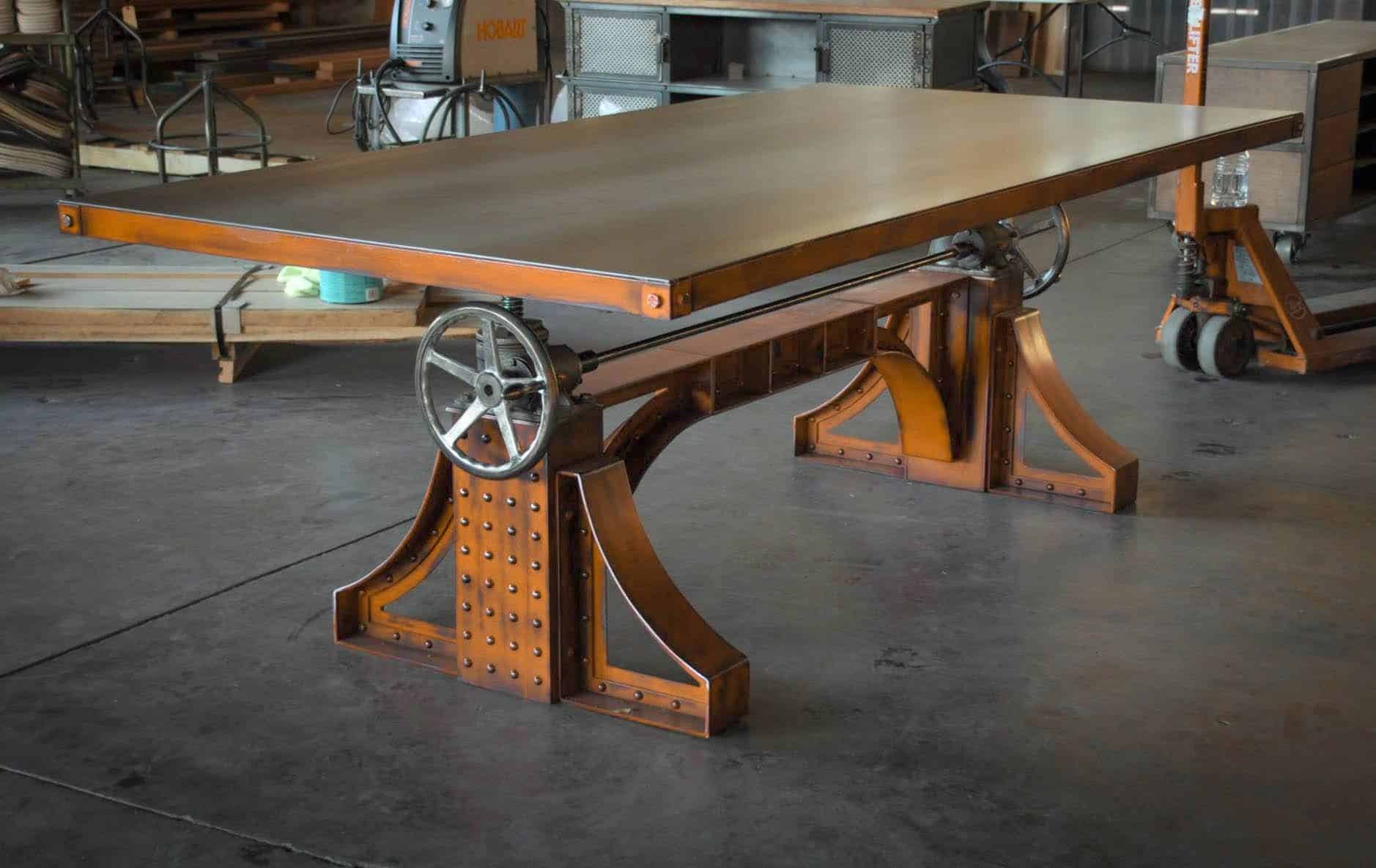 A Bronx Crank table with a orange base and metal table top. 