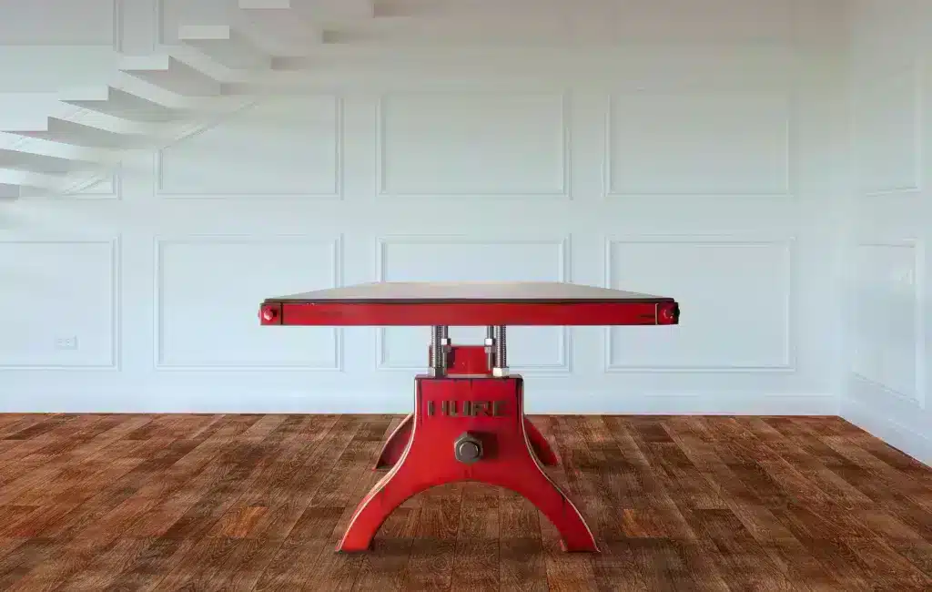 A sexy red Hure industrial table design with framed table top. 